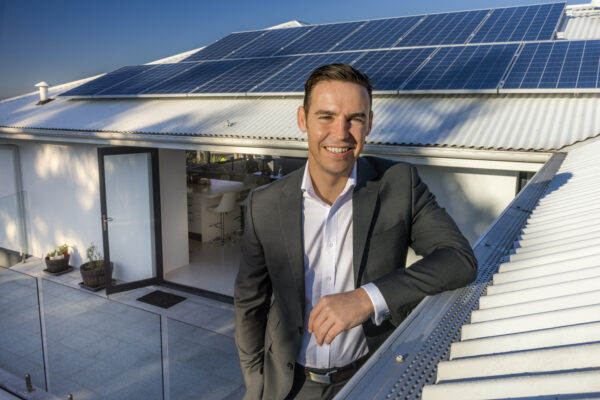 Evergen home storage featuring solar panels and Emlyn Keane, Operations Manager from Evergen