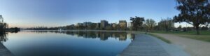 A lake with buildings surrounding it.