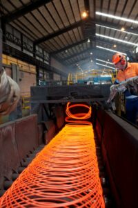 Glowing orange and red wire in a warehouse.